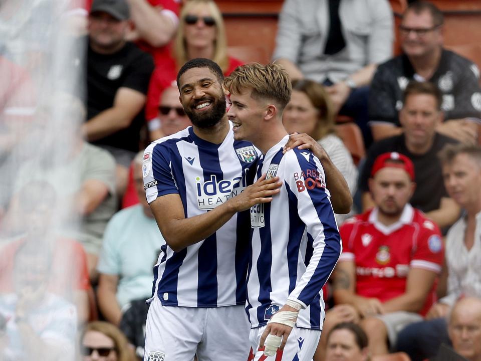 Isaac Price celebrates scoring at Wrexham with George Campbell