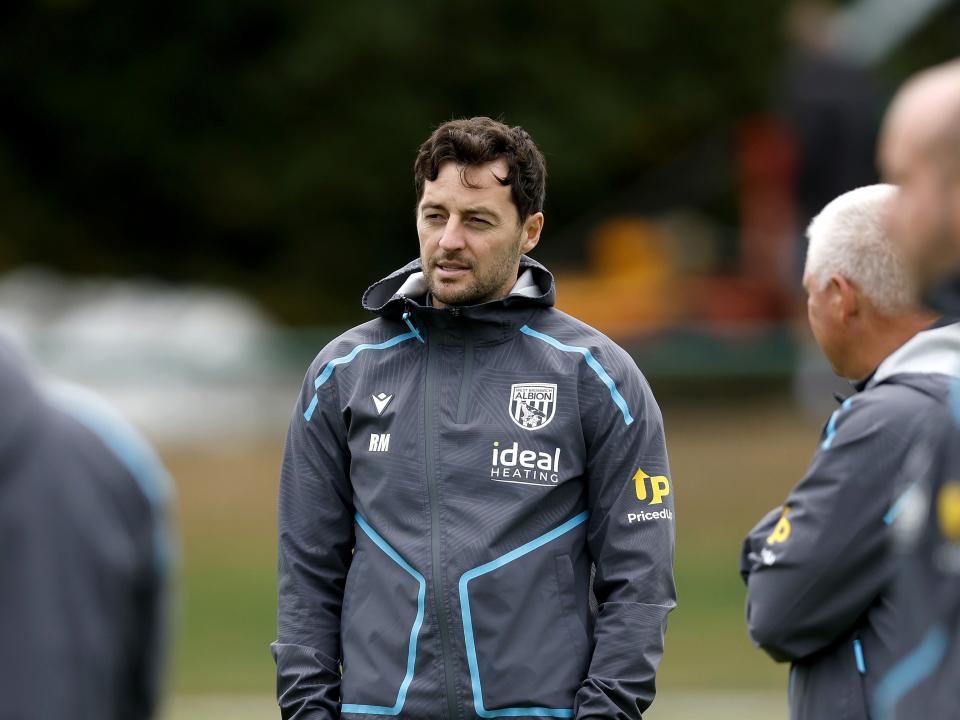 Ryan Mason watching a training session