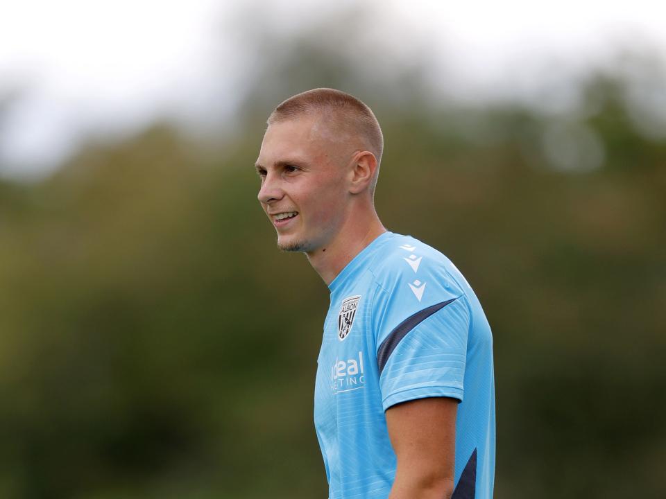 A photo of Albion striker Layton Love in the 2025/26 blue training kit