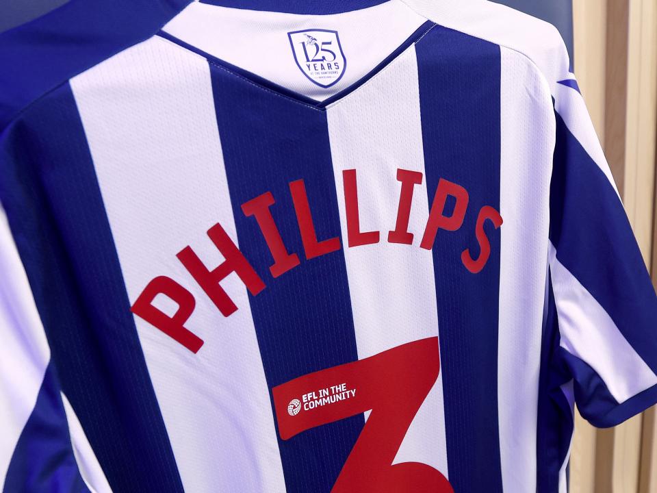 The back of Nat Phillips home shirt hanging up in the dressing room