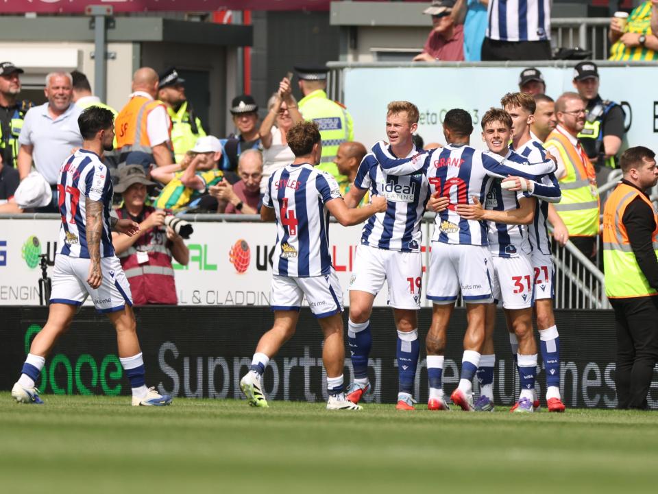 Isaac Price celebrates scoring his first goal at Wrexham with team-mates