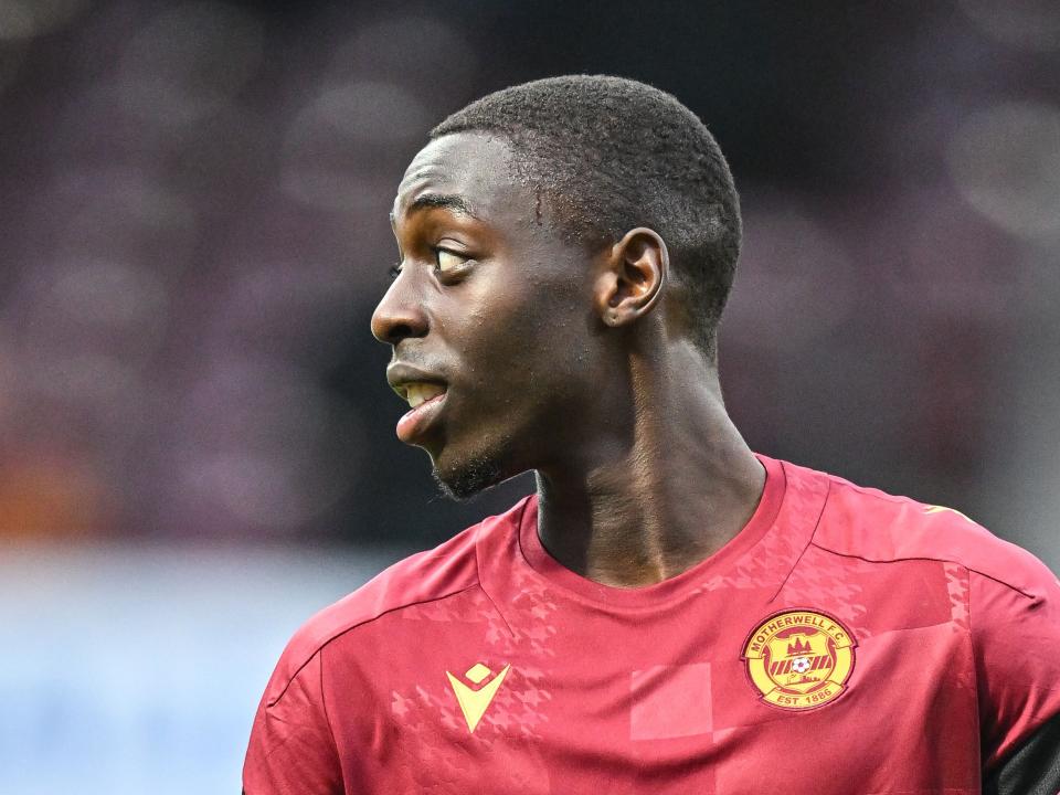 A close up of Eseosa Sule while warming up for Motherwell