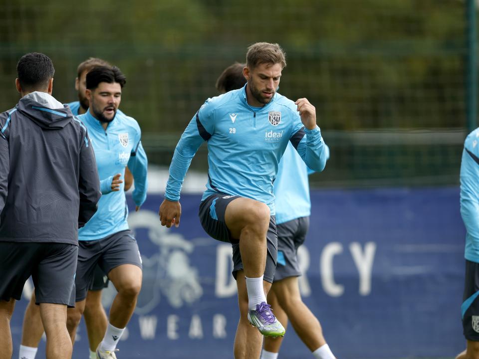 Charlie Taylor warming up before training