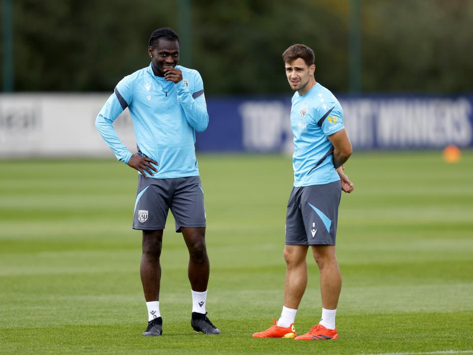 Jayson Molumby and Ousmane Diakité talking during training 