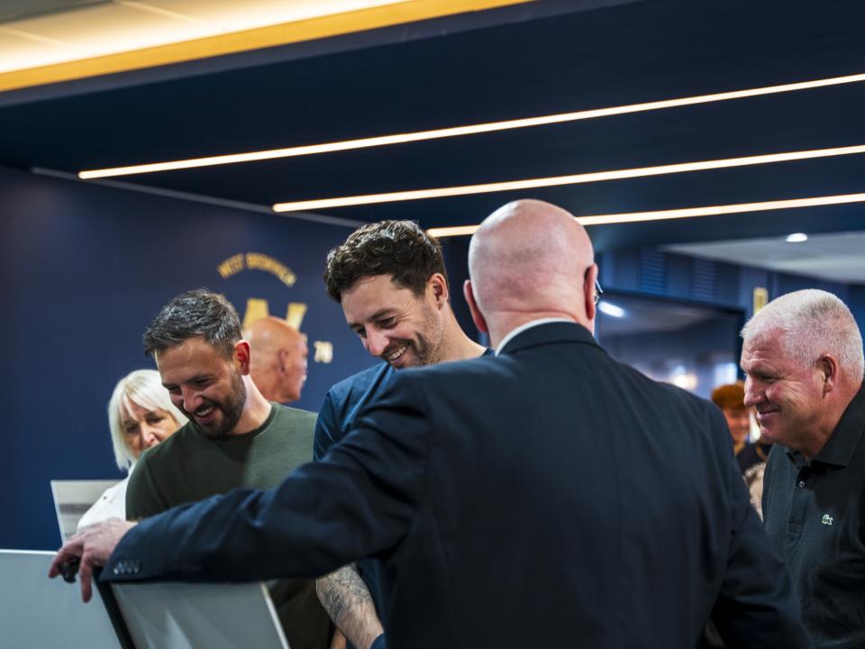 Ryan Mason walking through the East Stand looking at all the memorabilia and a specially curated gallery of 125 iconic Hawthorns images