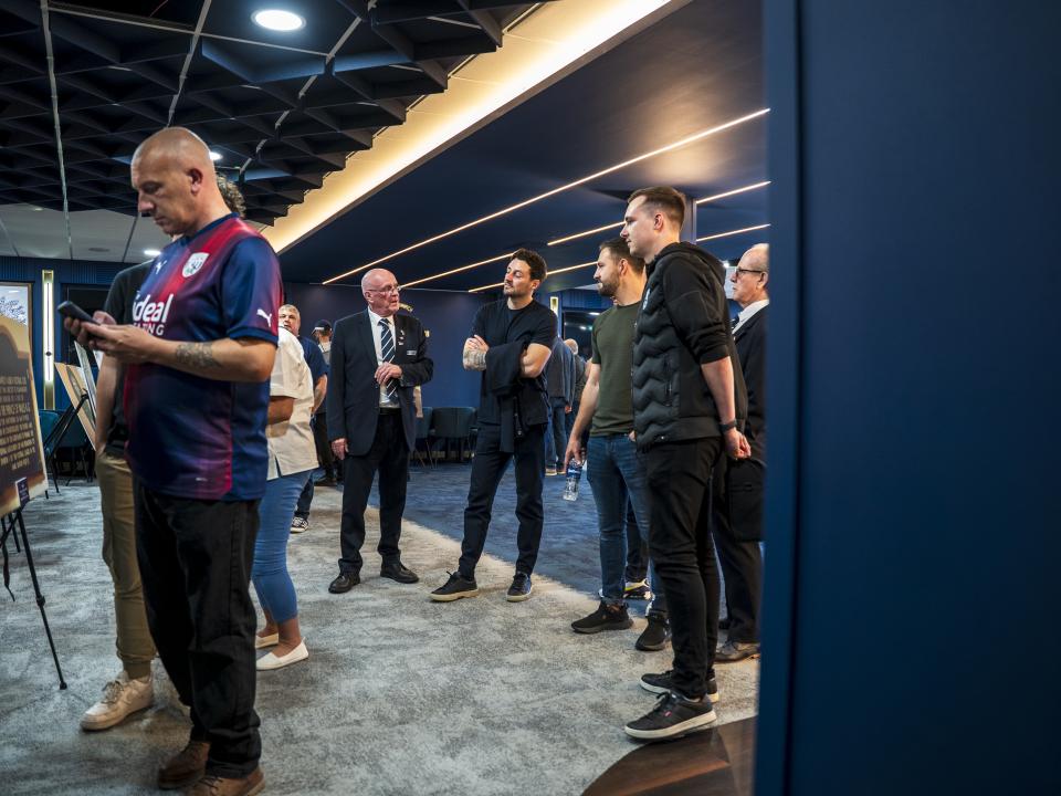 Ryan Mason walking through the East Stand looking at all the memorabilia and a specially curated gallery of 125 iconic Hawthorns images