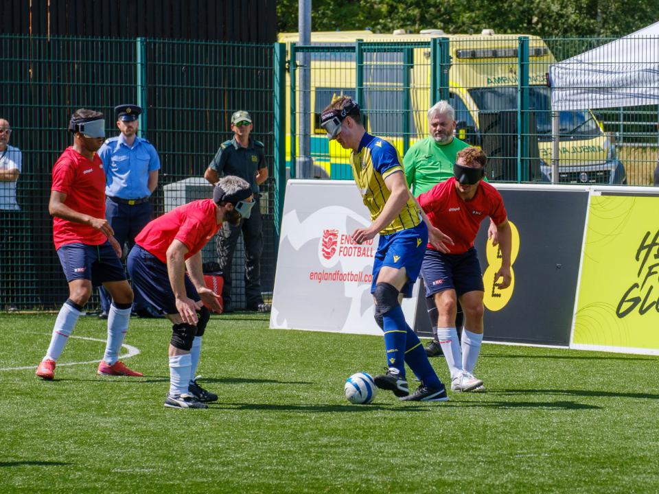 Efe Shimwell battles for possession against RNC.