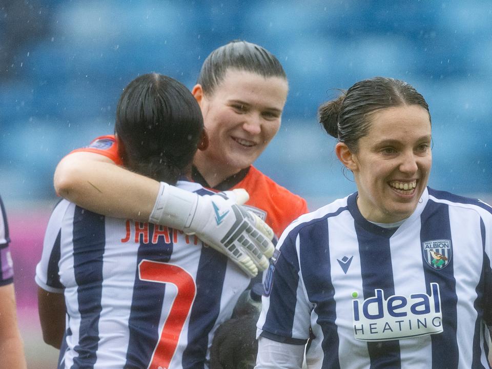 Simran Jhamat and Charlotte Clarke hug after a game 