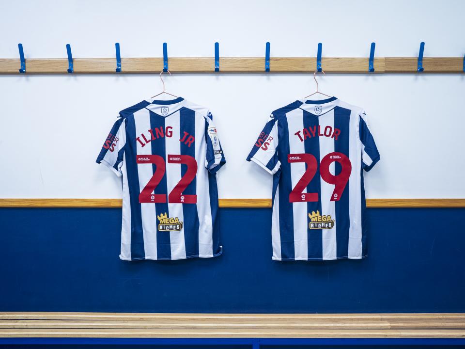 Samuel Iling-Junior's number 22 shirt and Charlie Taylor's number 29 shirt hanging in the dressing room