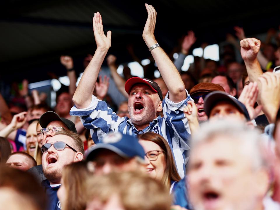 WBA fans cheering in the stand at a game