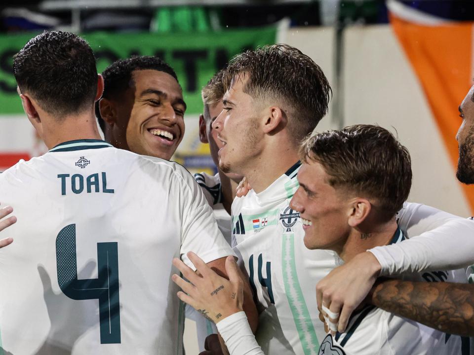 isaac Price celebrating a Northern Ireland goal with his team-mates