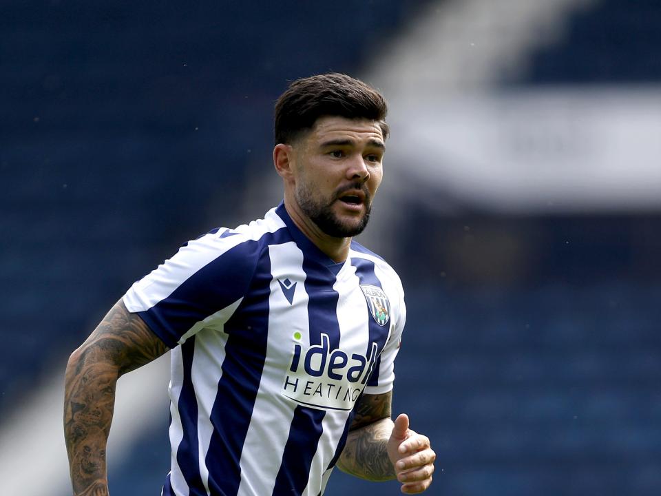 A photo of Alex Mowatt in the 2025/26 home kit