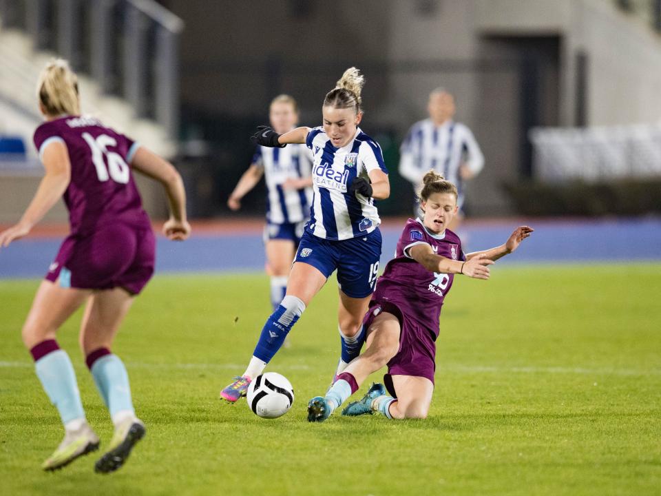 Monique Robinson battling for possession.