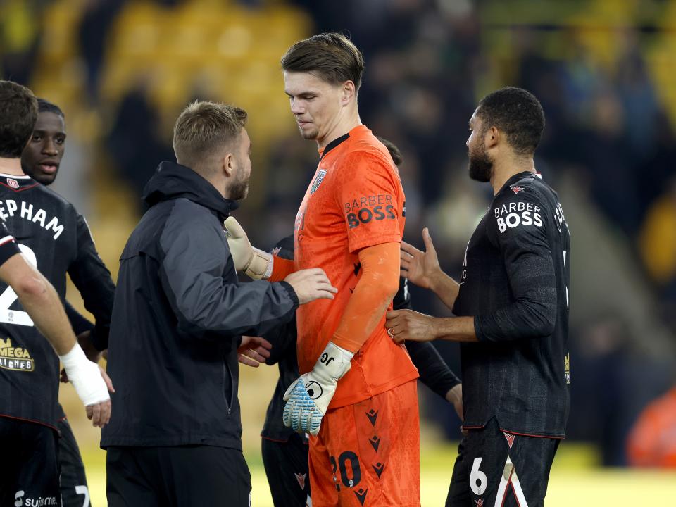 Josh Griffiths is congratulated by James Morrison at full-time against Norwich 