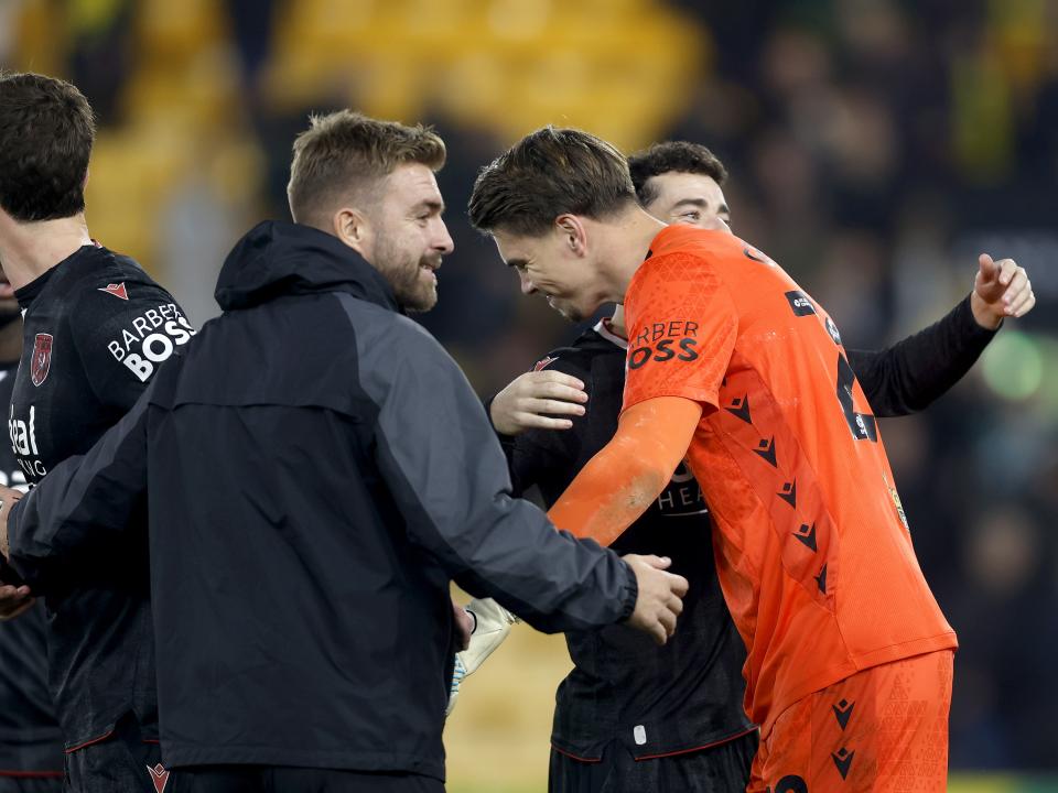 Josh Griffiths is congratulated by James Morrison at full-time against Norwich 