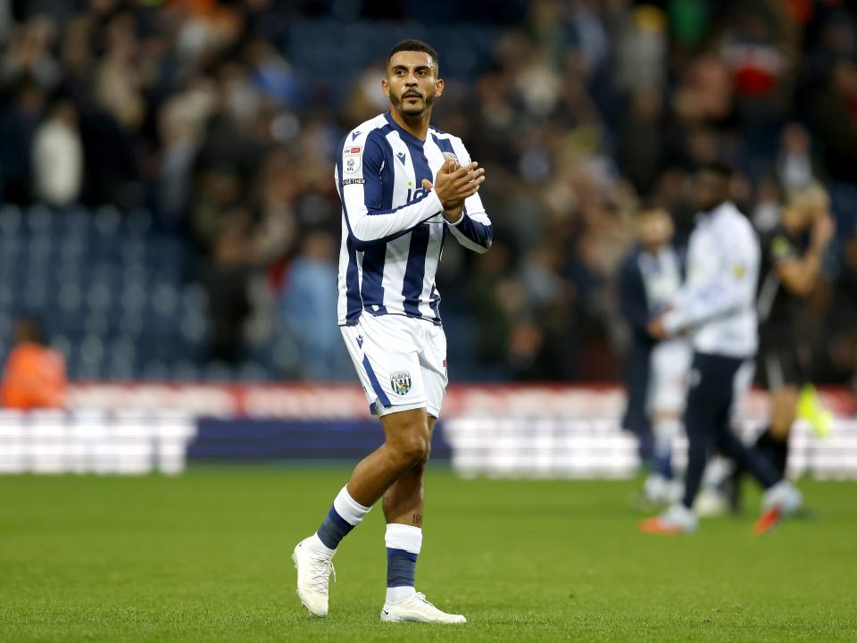 Karlan Grant applauds fans after the win over PNE 