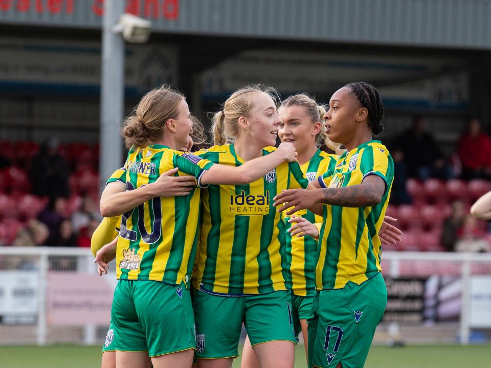 An image of Albion Women celebrating a goal against Derby