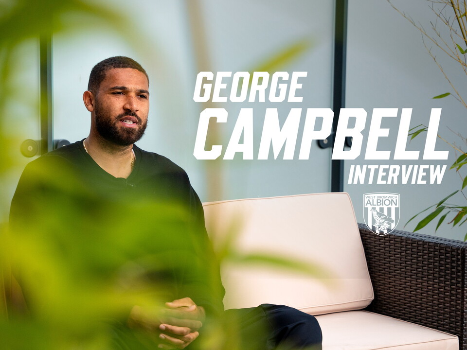 George Campell sat down on a sofa speaking to WBA TV with the words "George Campbell Interview" written on