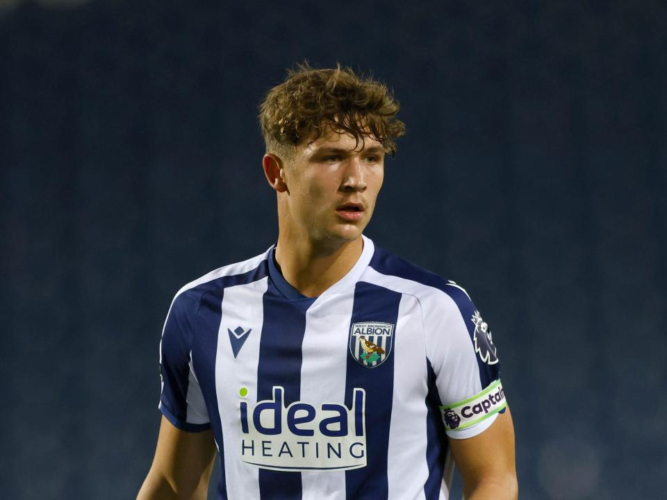 A photo of young midfielder Cole Deeming in the 2025/26 home kit