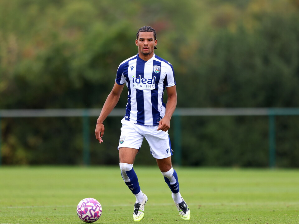 Antonio Perkins on the ball for WBA's U18 team in the home kit 