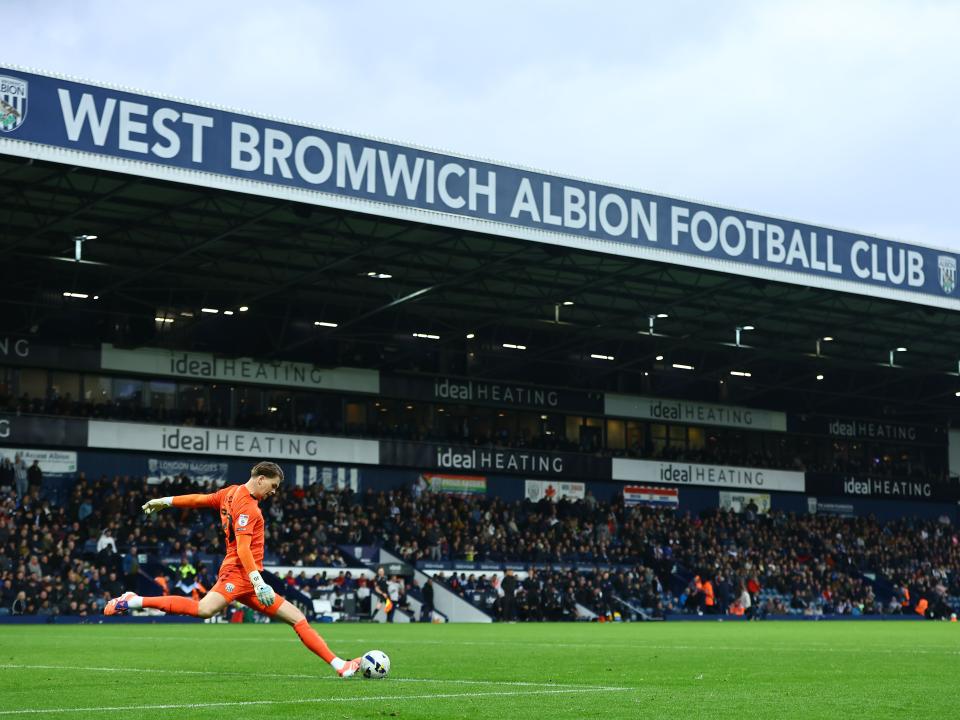Josh Griffiths in action against PNE with the Halfords Lane stand in the background 