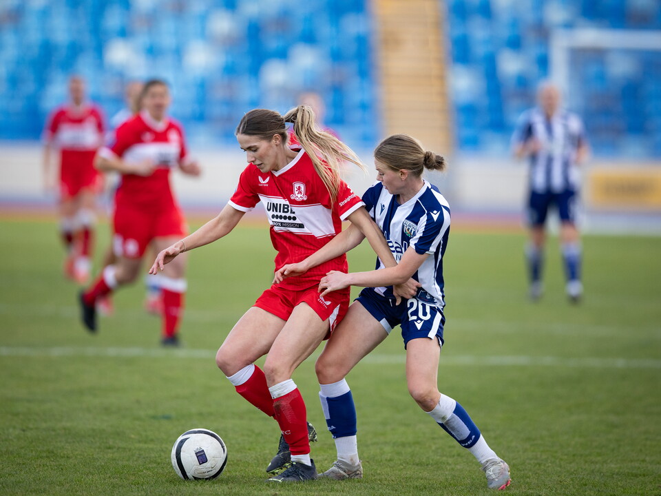 Phoebe Warner battles for the ball.