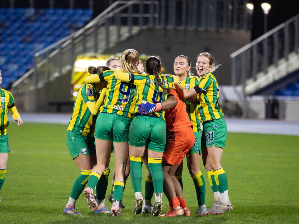 Albion Women celebrate in away colours.