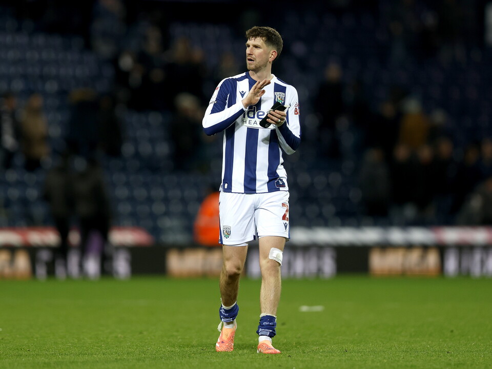 Chris Mepham applauds WBA fans after the Swansea game