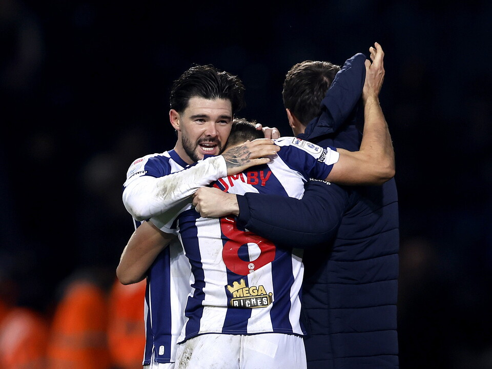 Jayson Molumby and Alex Mowatt celebrate after the win over Swansea 