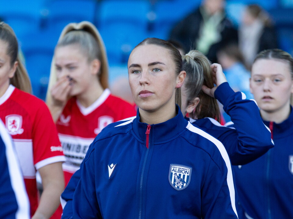 Seren Watkins walking out of the tunnel in a WBA tracksuit at the Alexander Stadium
