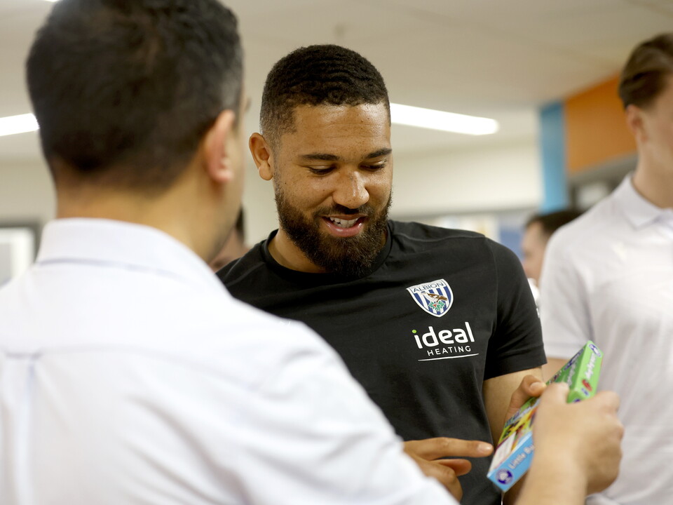 George Campbell looking down and smiling on a ward at Midlands Met hospital 
