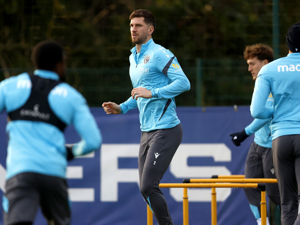 Chris Mepham warming up before a training session