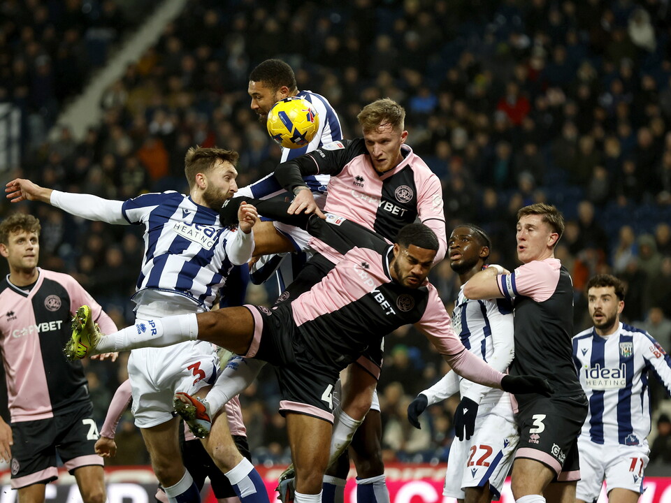Several WBA & QPR players fighting for the ball in the air
