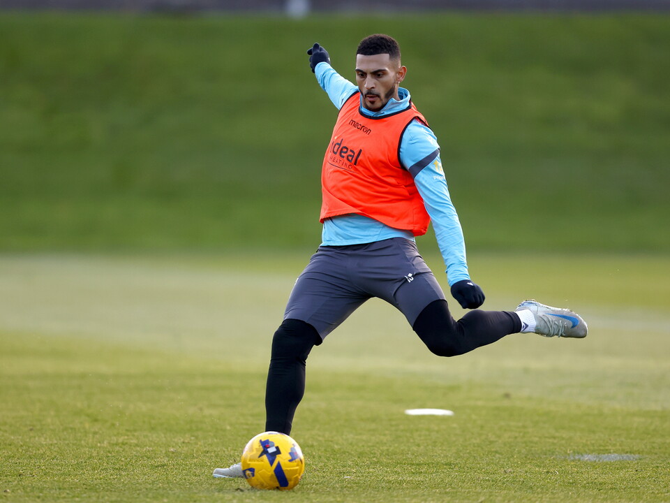 Karlan Grant striking the ball during a training session