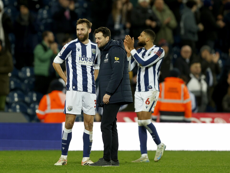 Nat Phillips and Ryan Mason smiling on the pitch after beating Sheffield United 