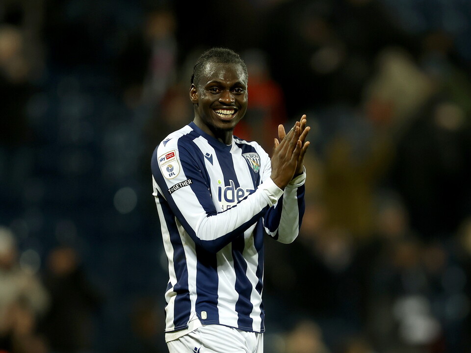 Ousmane Diakité applauds WBA fans after the win over QPR 