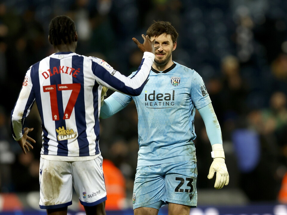 Joe Wildsmith and Ousmane Diakité embrace after beating QPR 