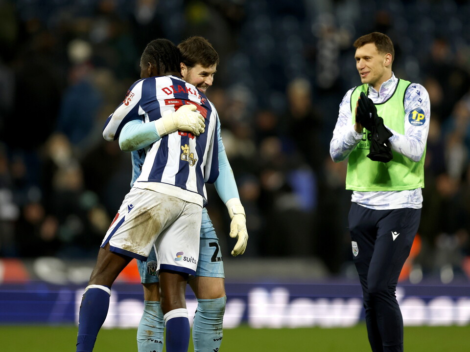 Joe Wildsmith and Ousmane Diakité embrace after beating QPR 