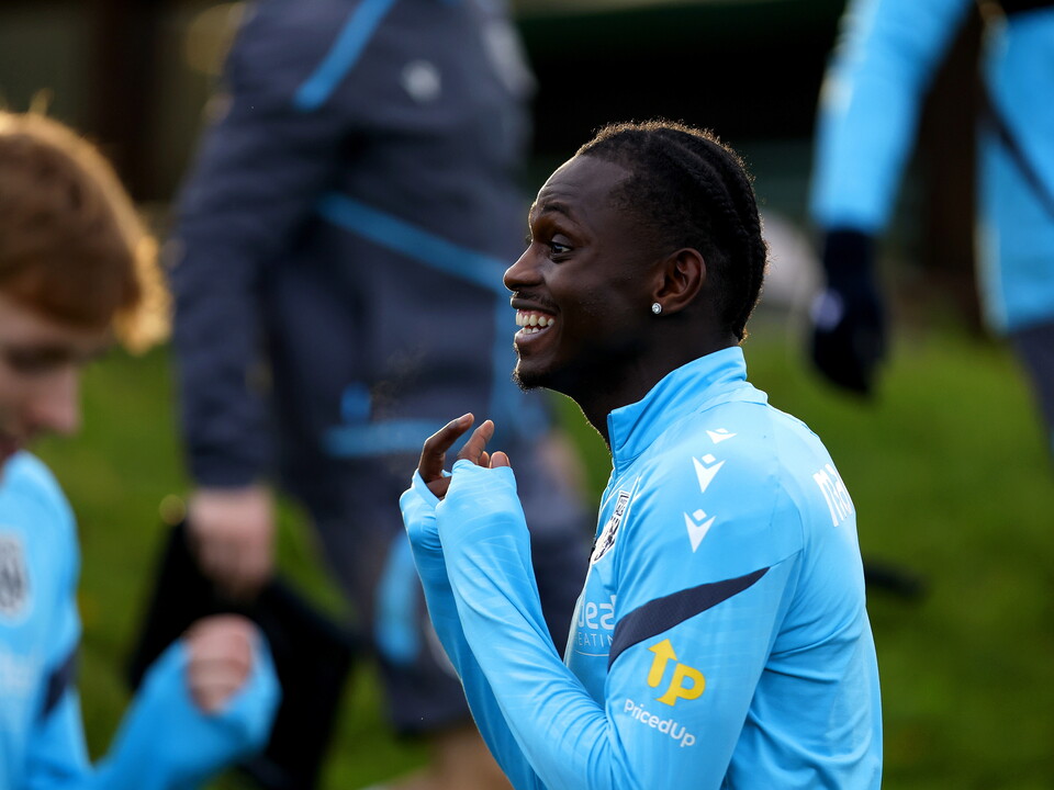Ousmane Diakité smiling during a training session