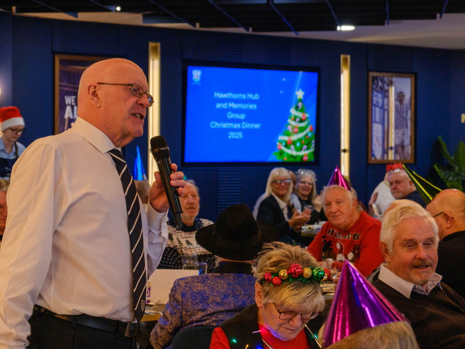 Jon Homer speaking on the mic.