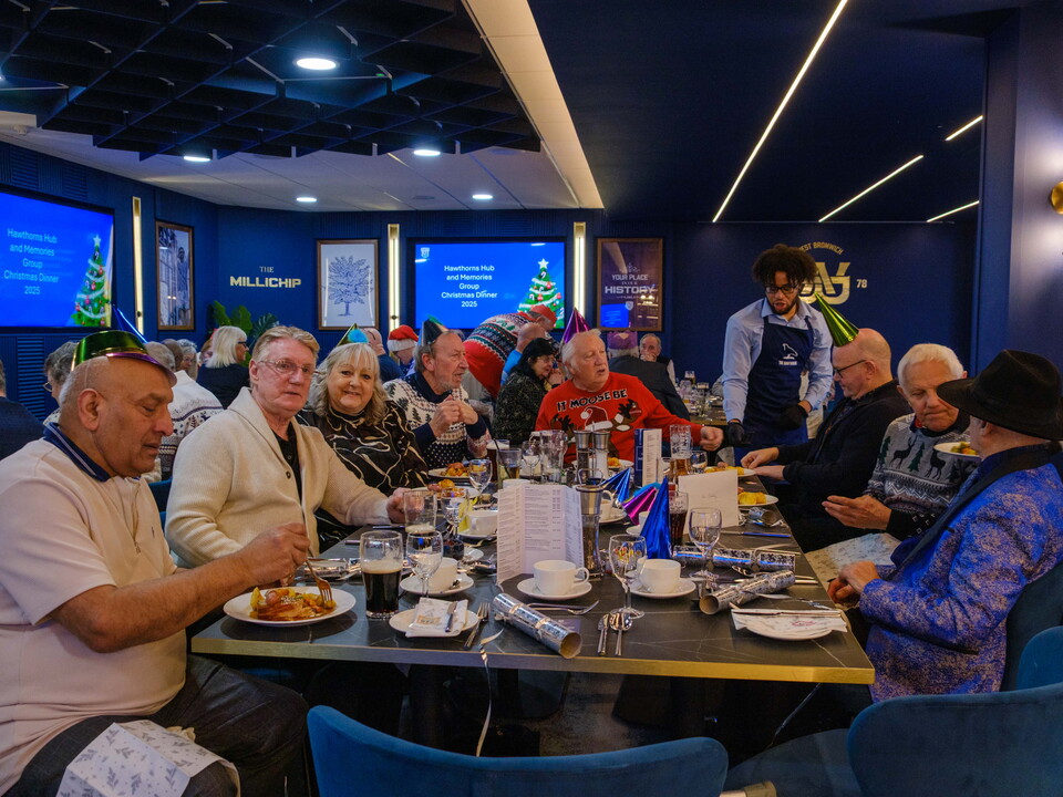 Memories group participants seated at their table.