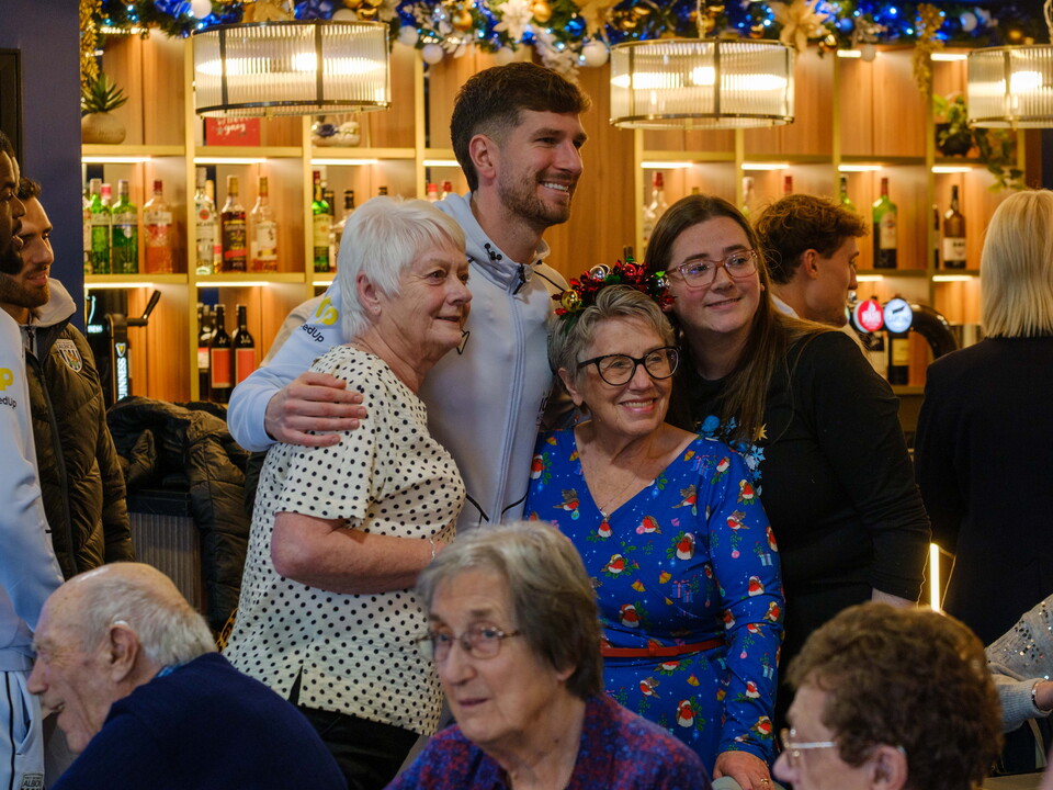 Mepham taking a photo with participants.