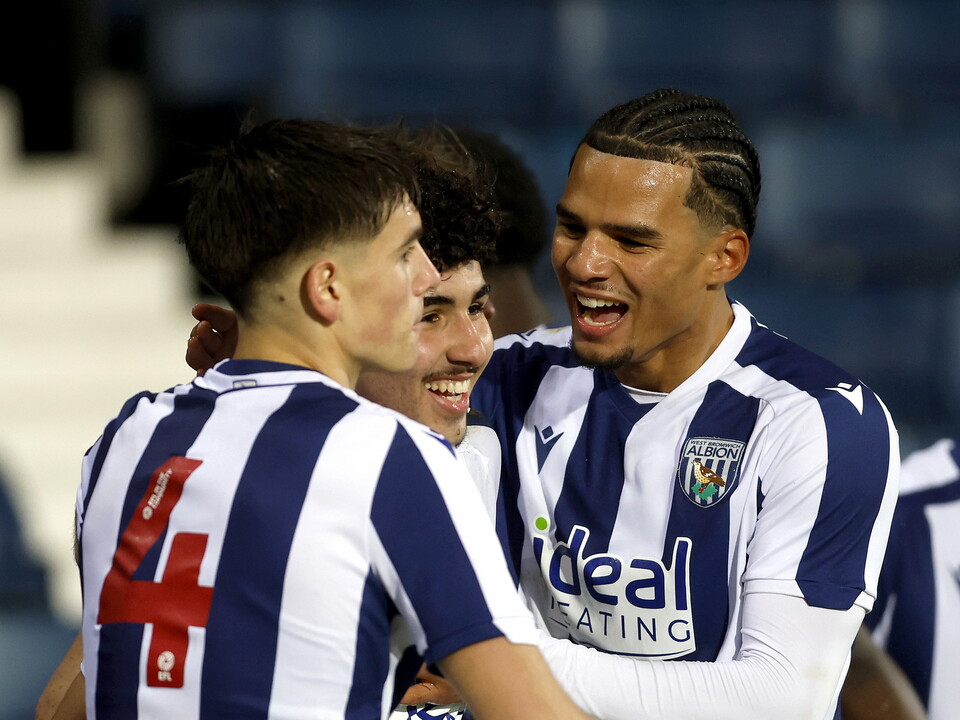 Adam Letlat celebrates with two team-mates after scoring against AFC Bournemouth 