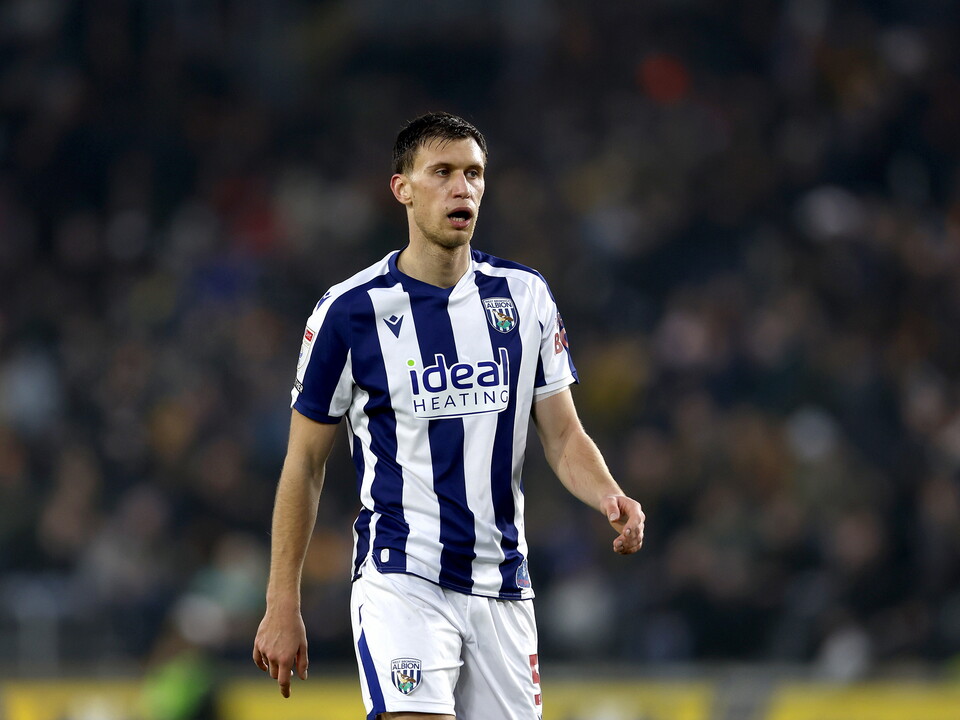 Krystian Bielik in action for WBA in the home kit 