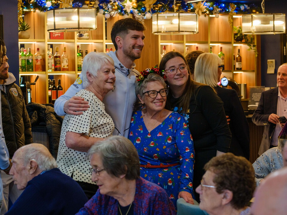 Mepham taking a photo with participants.