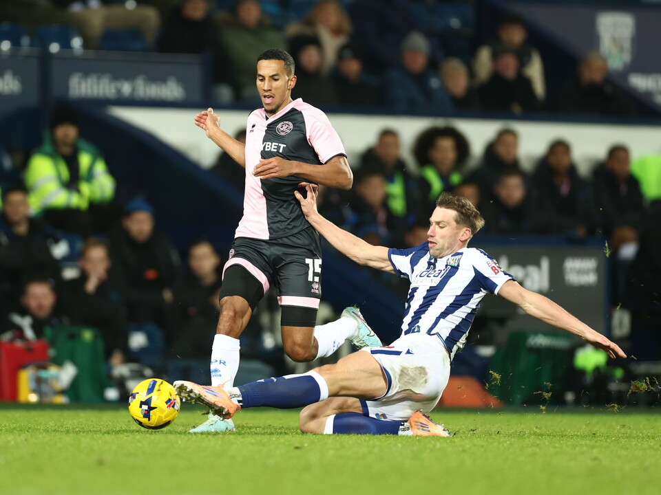 Charlie Taylor making a lunging tackle against QPR