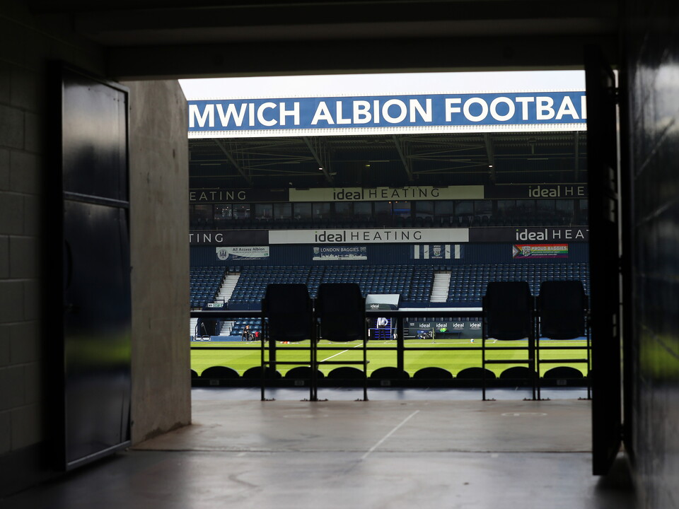An image of The Hawthorns through the East Stand concourse