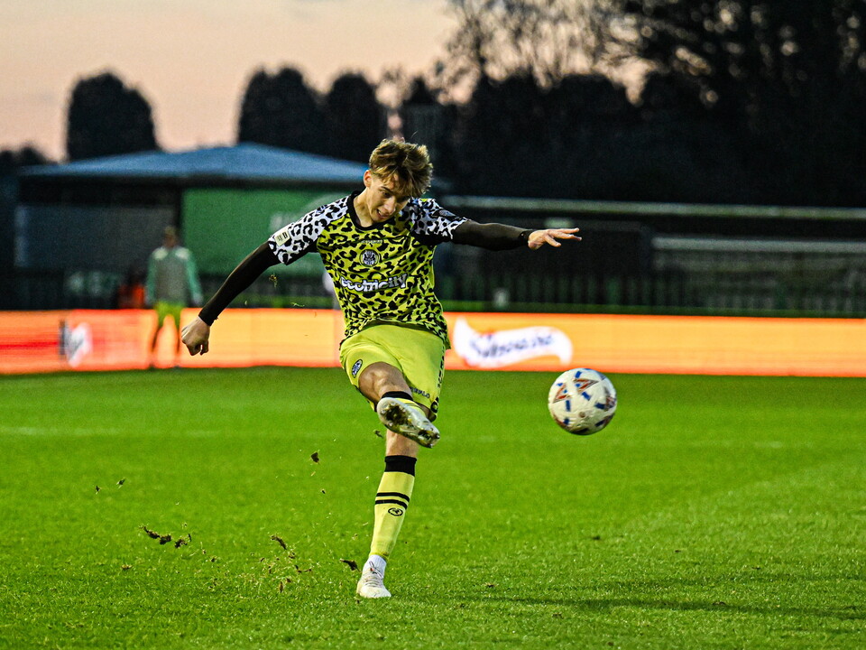 Harry Whitwell crossing the ball while playing for Forest Green Rovers