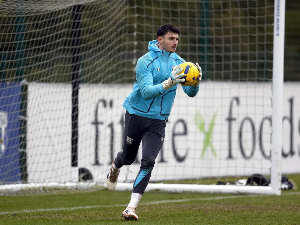 Max O'Leary holding a ball in training