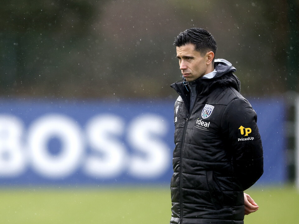 Eric Ramsay watching training in the rain